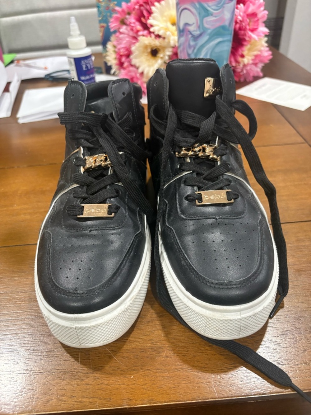 Black High-Top Sneakers with Gold Accents